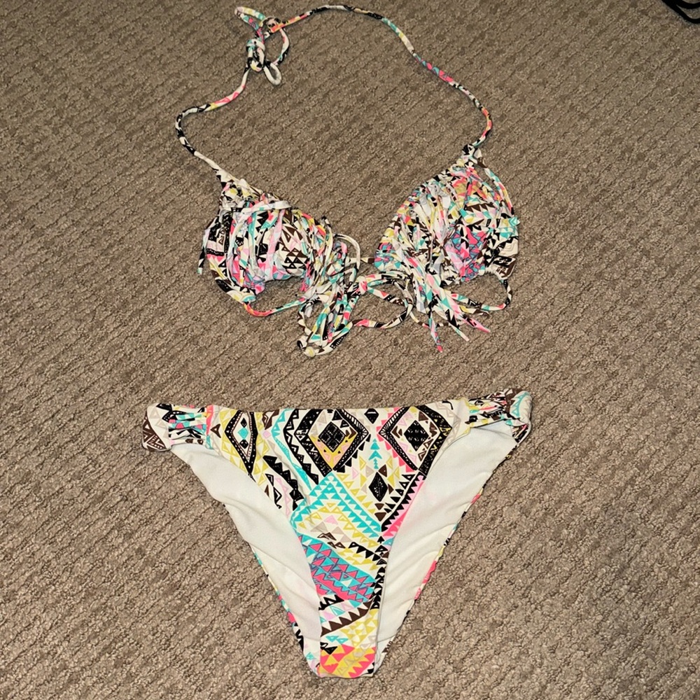 Size small runs smaller so more like an xs oneil bathing suit
